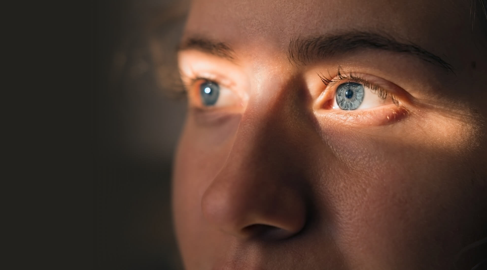 Close up of a face with spotlight on the eyes